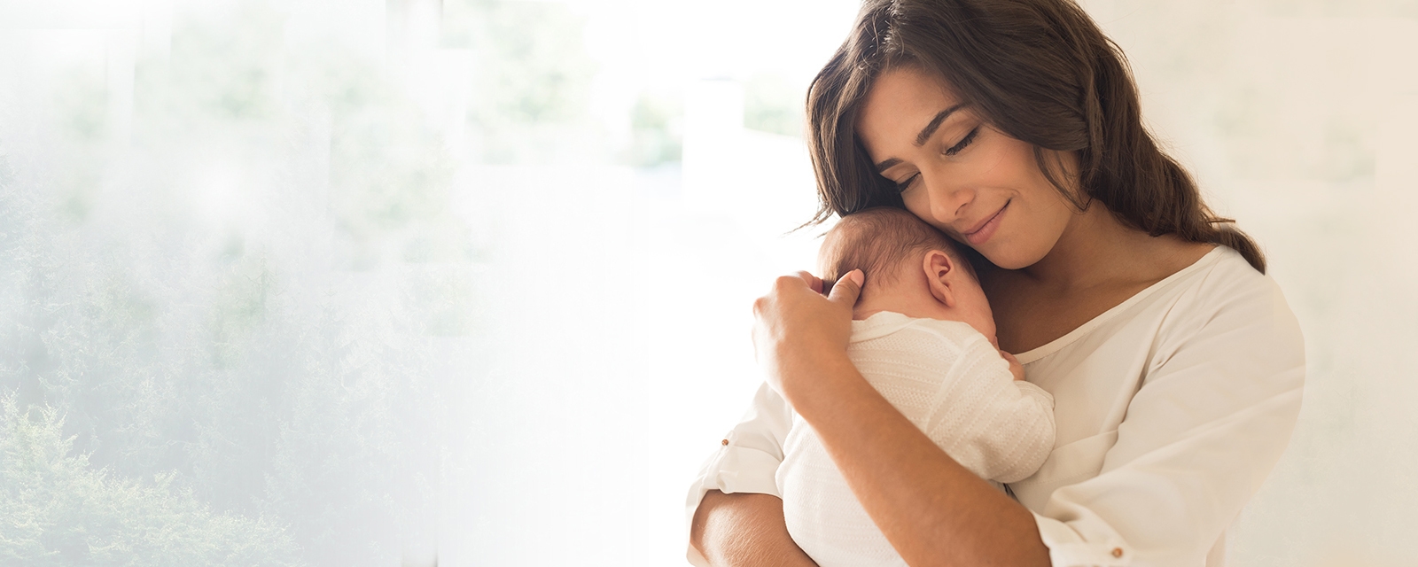 mother holding newborn infant